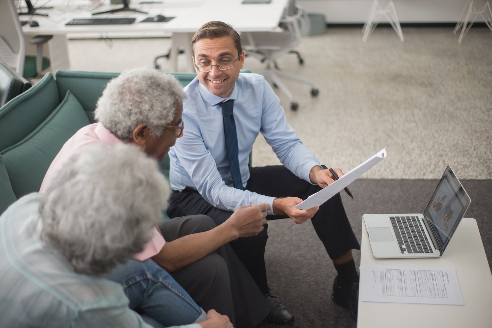 Attorney meeting with a client to review case documents